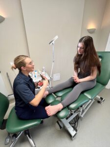 Woman being treated by a podiatrist